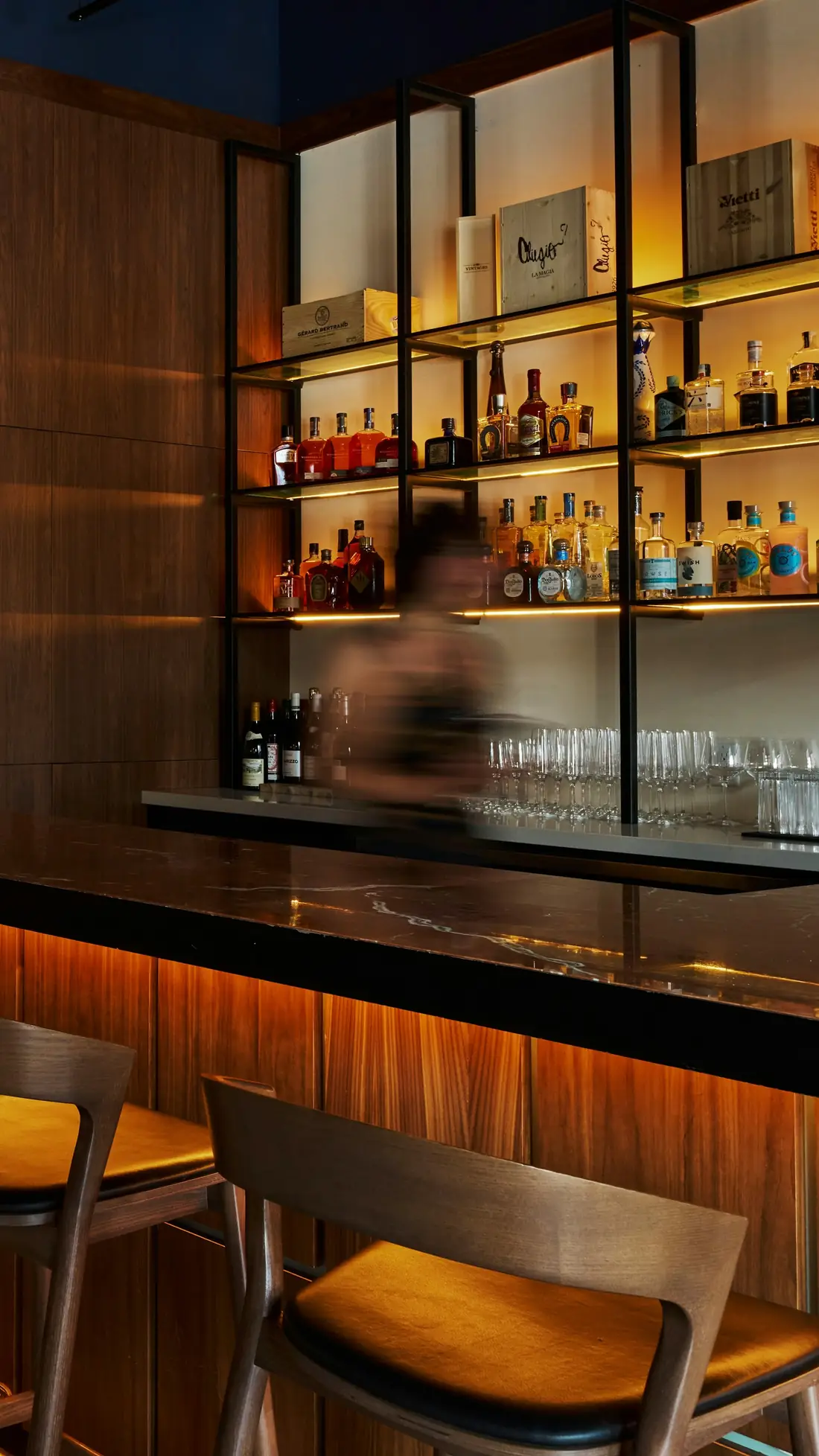 Warmly lit shelves of spirits